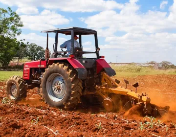 Tractor plowing land